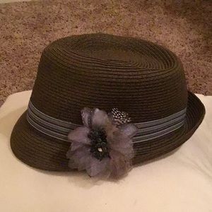 Brown fedora hat blue flower